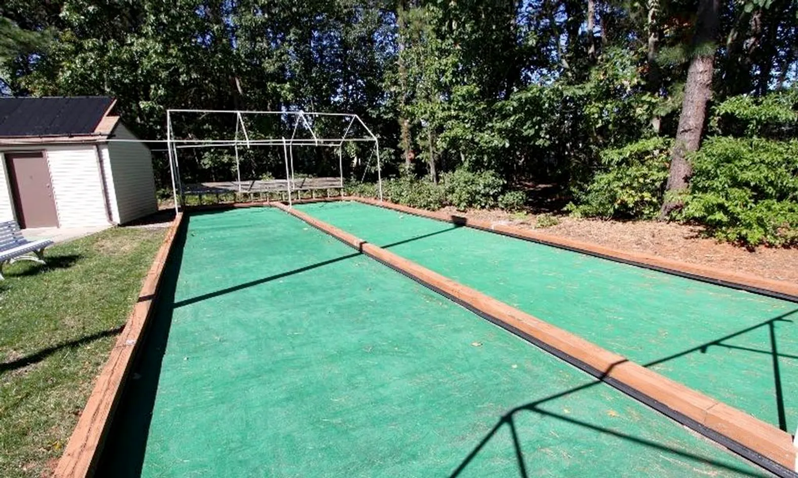 Bocce ball court with tournament markers and covered seating